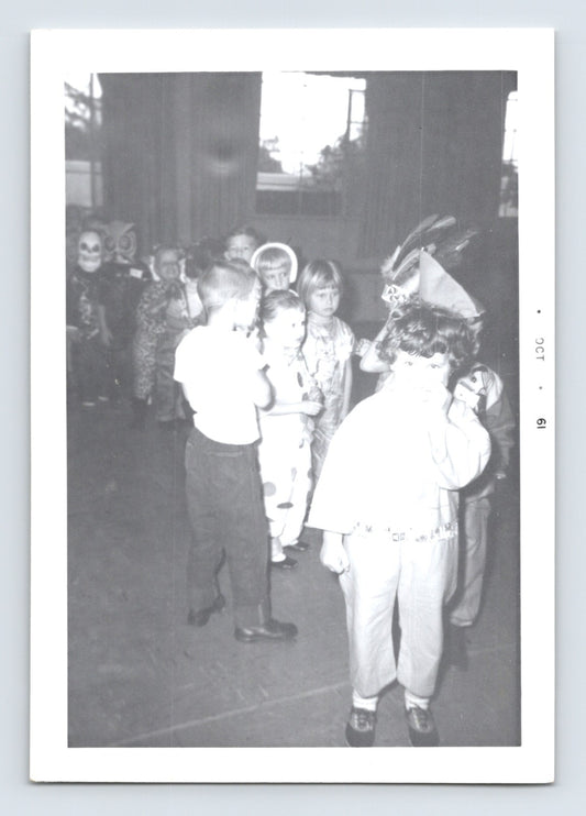Halloween vintage photo children costume line masks classroom 1960s snapshot kids dressed up school scene 5 x 3.5
