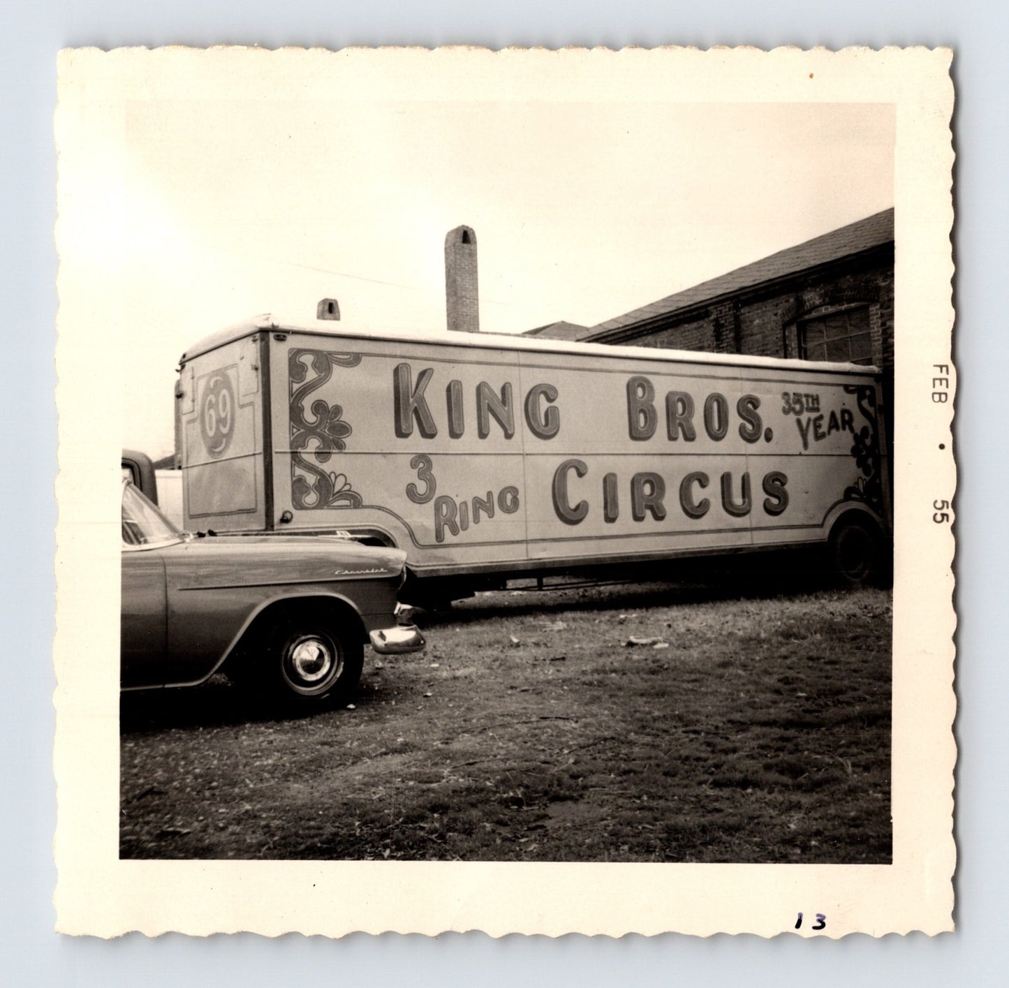 King Bros Circus three ring circus trailer parked beside brick circus building February 1955 photo