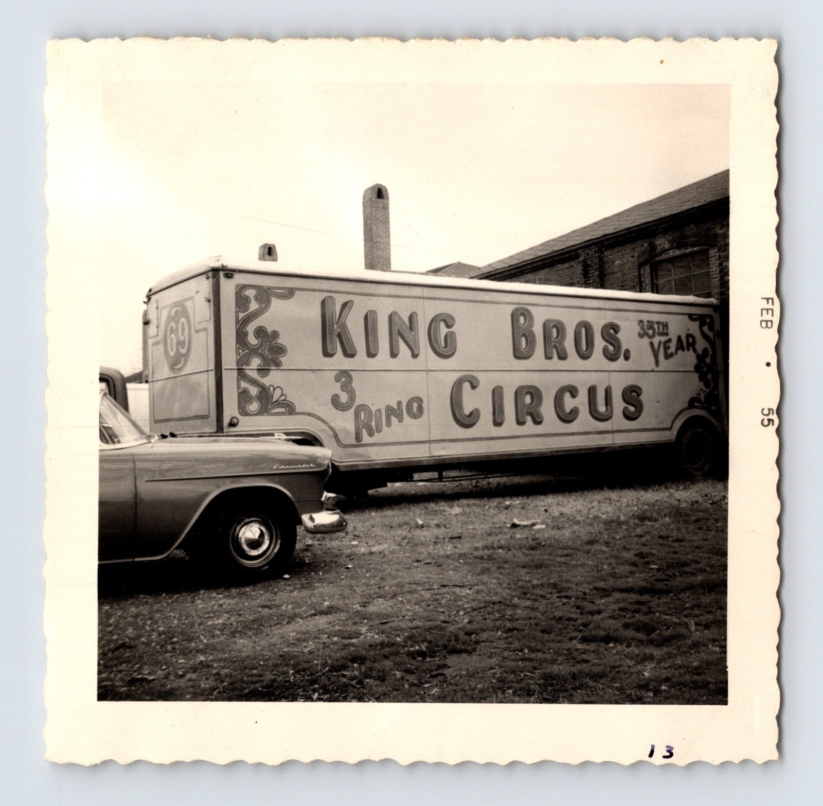 King Bros Circus three ring circus trailer parked beside brick circus building February 1955 photo