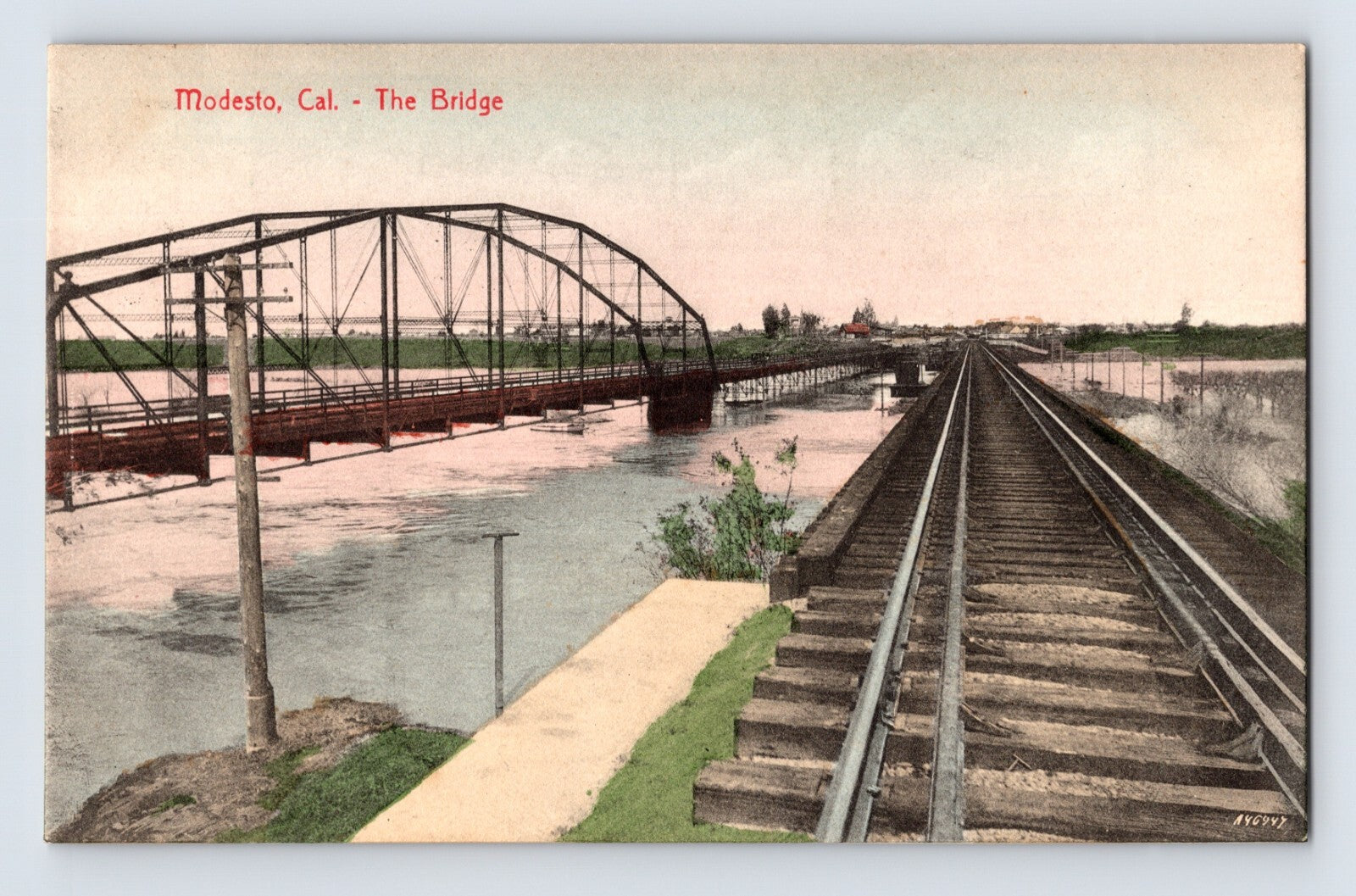 Modesto California Southern Pacific railroad bridge and track crossing river early twentieth century postcard