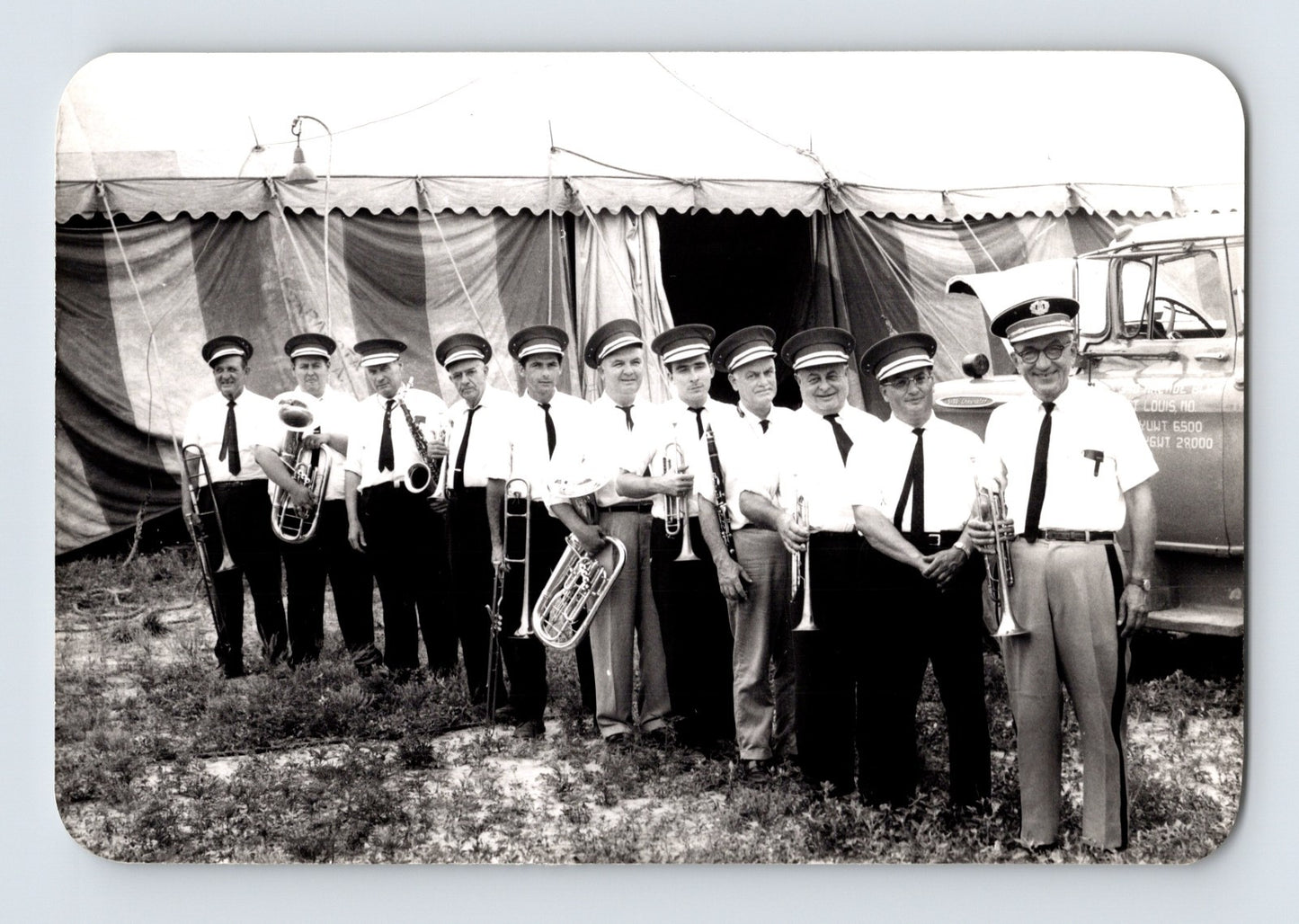 Mills Bros Circus 1962 brass band musicians lined up with instruments beside circus tent photograph
