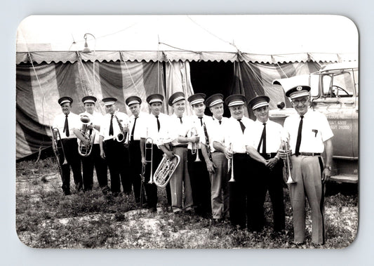 Mills Bros Circus 1962 brass band musicians lined up with instruments beside circus tent photograph