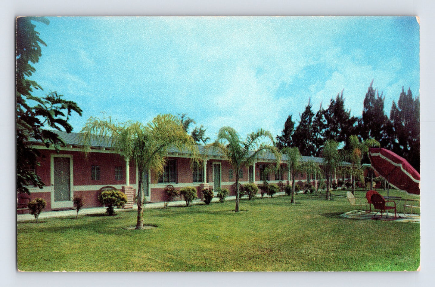 Largo Florida Holiday Inn motel courtyard palm trees mid-century motor lodge 1960s chrome postcard exterior lawn walkway