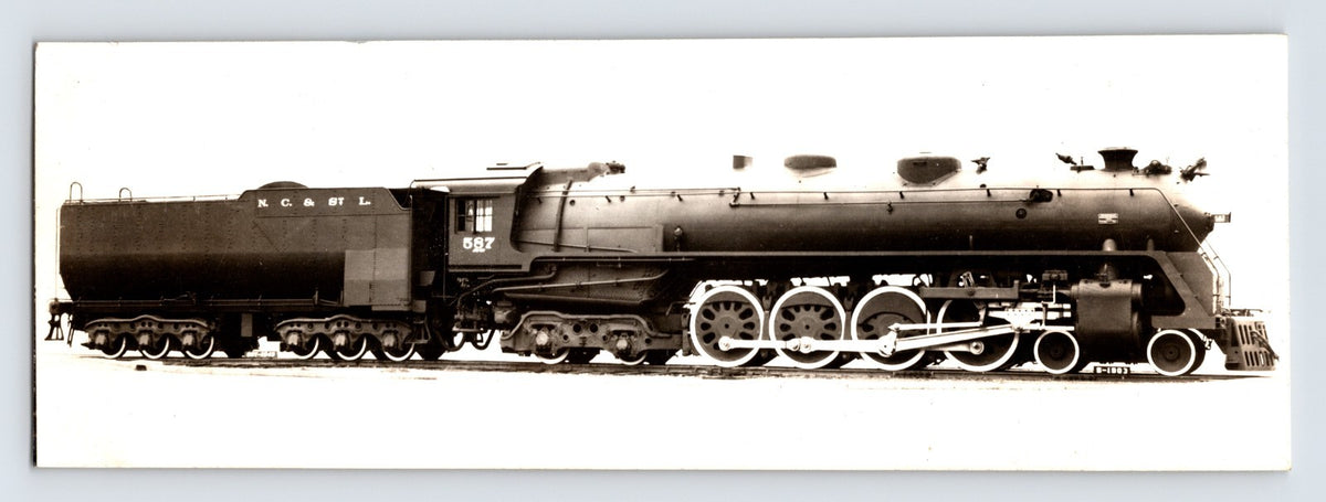 Side profile photograph of Nashville Chattanooga St Louis Railroad steam locomotive Northern type 1940s