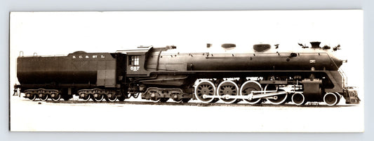 Side profile photograph of Nashville Chattanooga St Louis Railroad steam locomotive Northern type 1940s