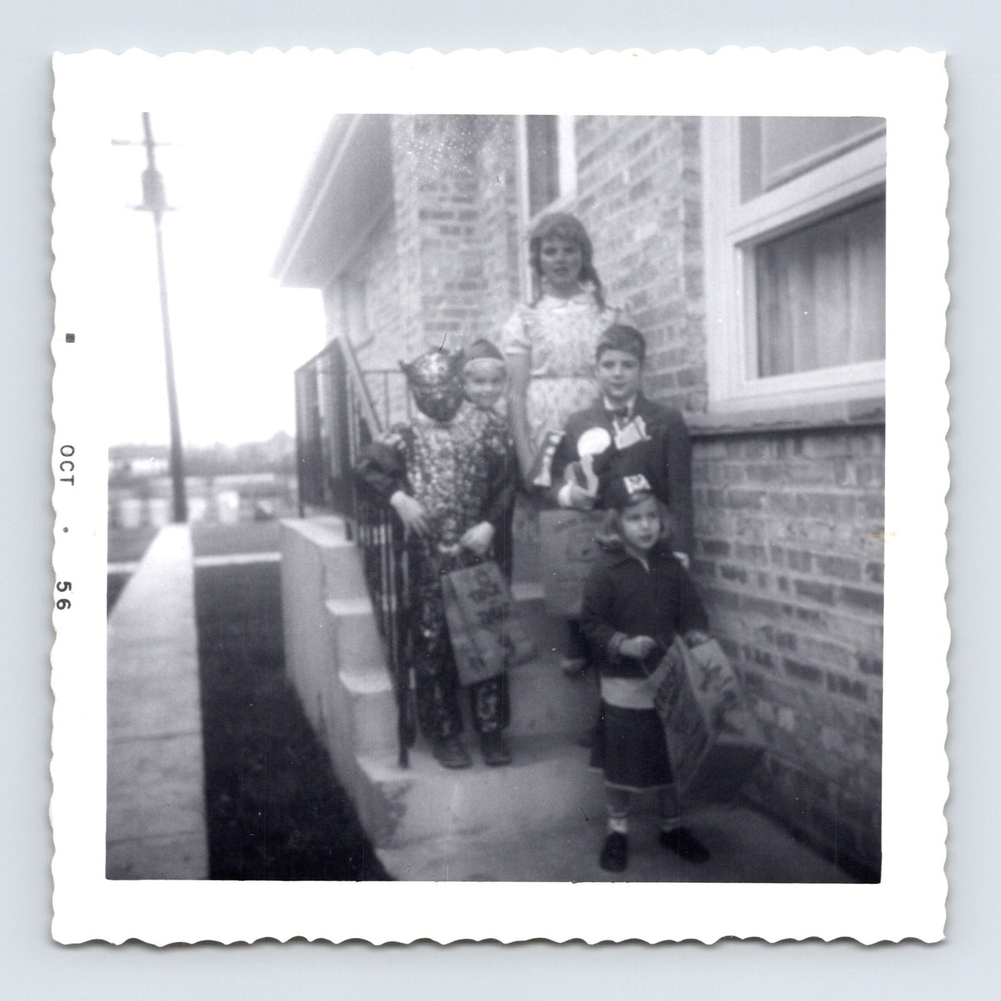 Halloween children costumes trick or treat bags porch steps 1950s snapshot vintage photo 3.5 x 3.5