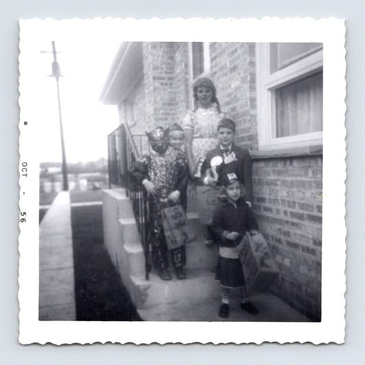 Halloween children costumes trick or treat bags porch steps 1950s snapshot vintage photo 3.5 x 3.5