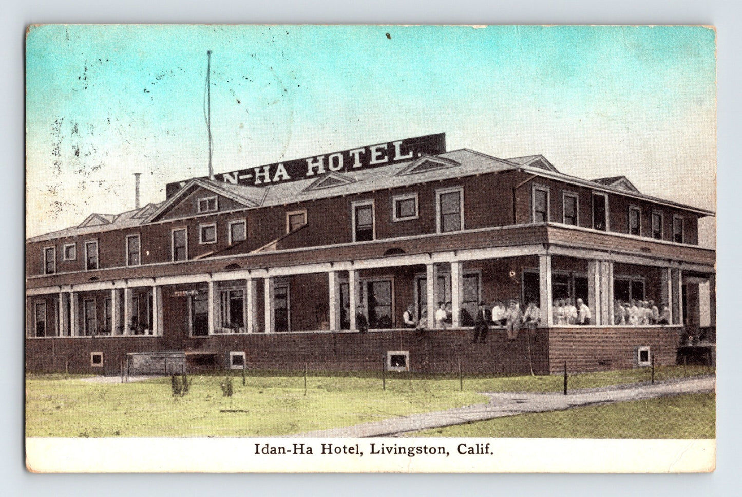 Idan Ha Hotel Livingston California 1912 divided back postcard with brick hotel and wraparound porch
