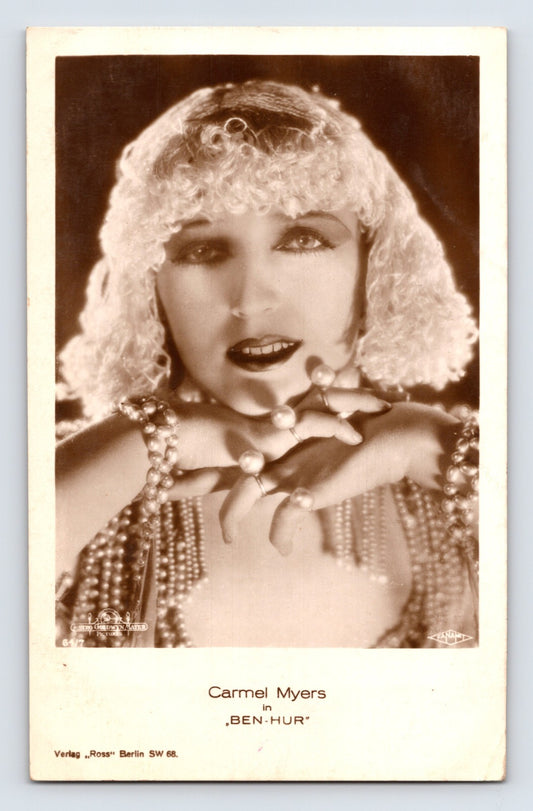 1920s real photo postcard of Carmel Myers in Ben-Hur wearing jeweled headdress and layered pearls in studio portrait