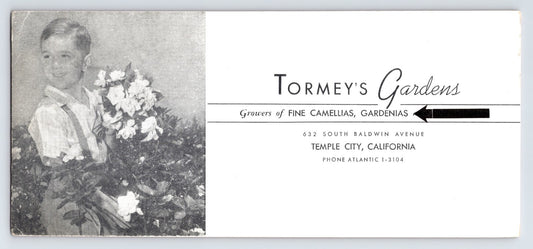 1940s Tormey’s Gardens advertising blotter from Temple City California featuring child holding camellias and gardenias, pink reverse