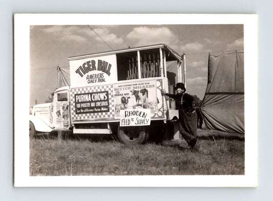 Black and white photograph of Tiger Bill’s Wild West Circus truck with clown Rube Roy 1952