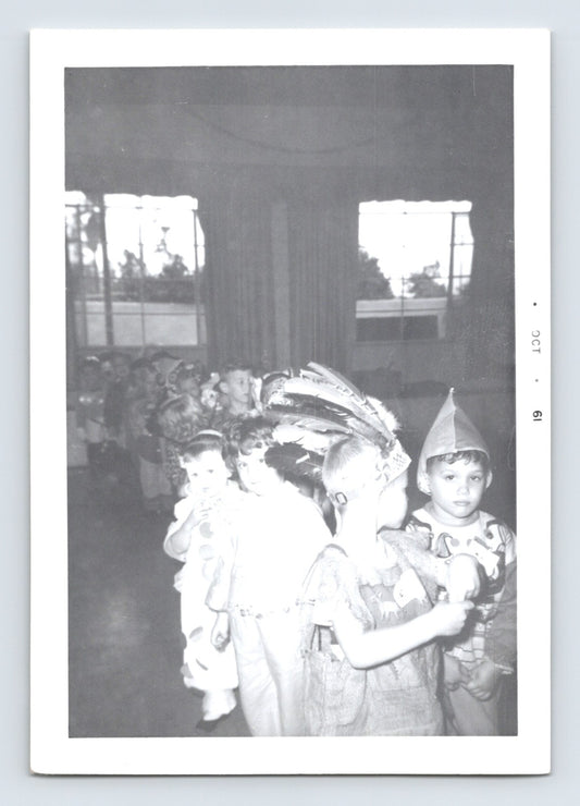 Halloween photo children costume parade classroom feather headdress clown indoor party 1961 snapshot October margin 5 x 3.5