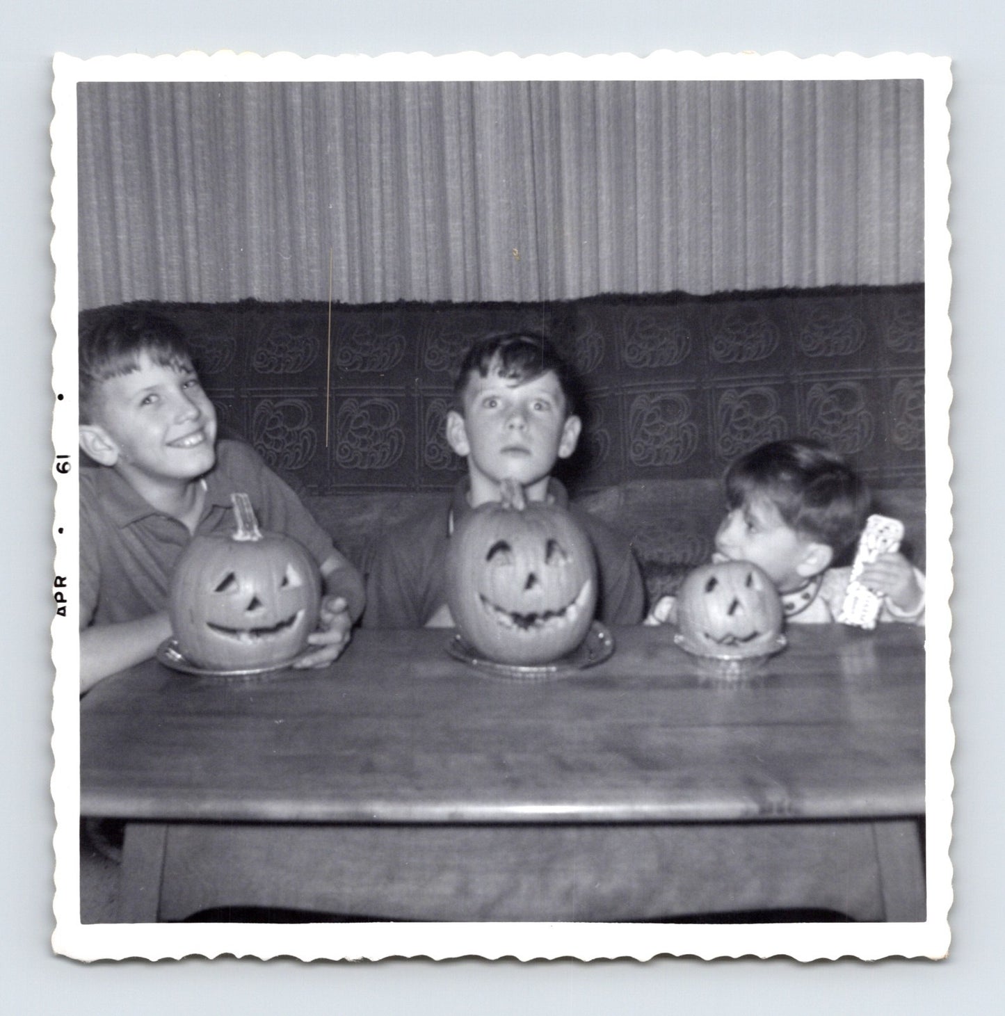 Halloween children carved pumpkins jack o lantern table 1960s snapshot vintage photo 3.5 x 3.5