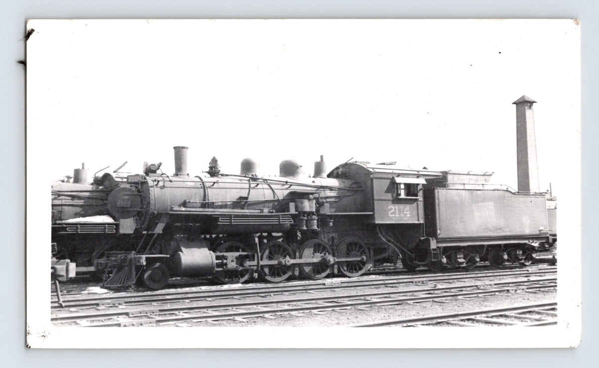 Black and white photograph of Canadian National 2-8-0 steam locomotive 2114 at Winnipeg rail yard 1948