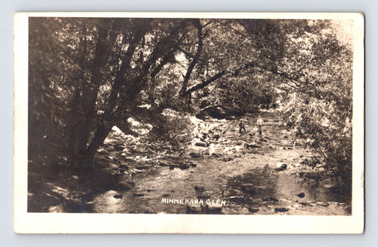 Minnesota Minnehaha Glen 1910s real photo postcard showing wooded creek with rocks shaded by trees natural landscape scene