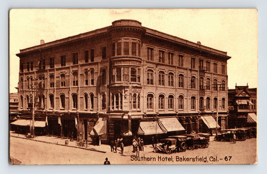 1911 Bakersfield California Southern Hotel postcard showing large multi story corner hotel building with storefront awnings and street activity