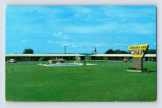 Chrome postcard of Barbara Ann Motel in Ozark Alabama showing roadside sign, swimming pool, and single-story motor court along Highway 231