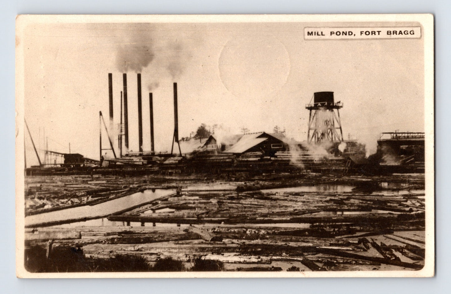 Mill Pond lumber operation Fort Bragg California smokestacks logging RPPC 1940s postcard front view