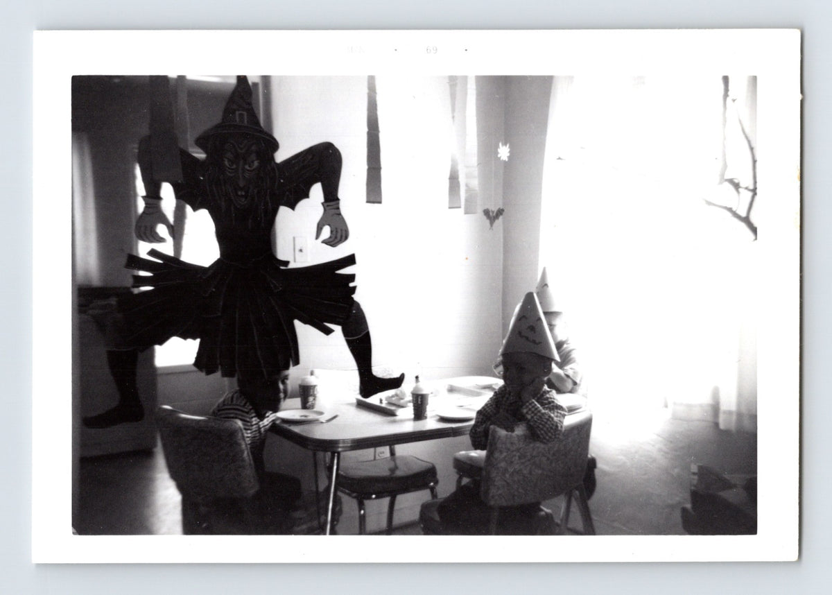Halloween party children table witch decoration black cat cutout 1960s snapshot