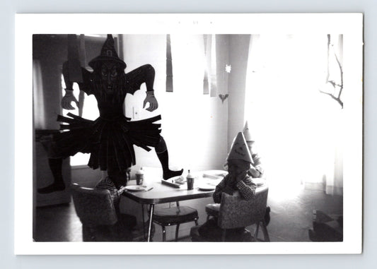 Halloween party children table witch decoration black cat cutout 1960s snapshot