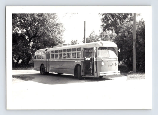 Black and white photograph of Philadelphia trolley bus number 608 signed Whitehall with twin trolley poles raised, stopped along a tree-lined street.