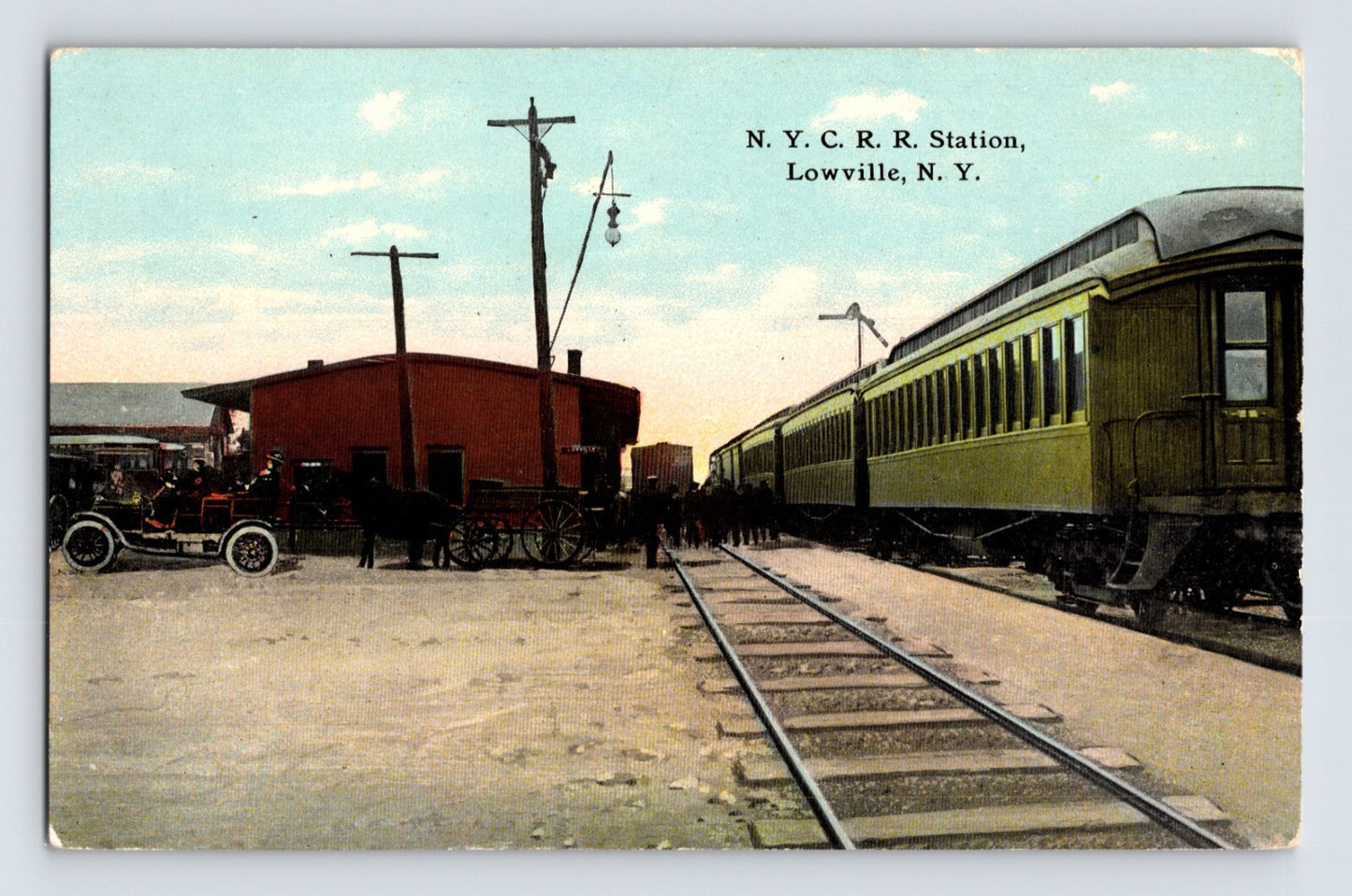 Lowville New York New York Central Railroad Station 1910s postcard showing passenger train and depot scene