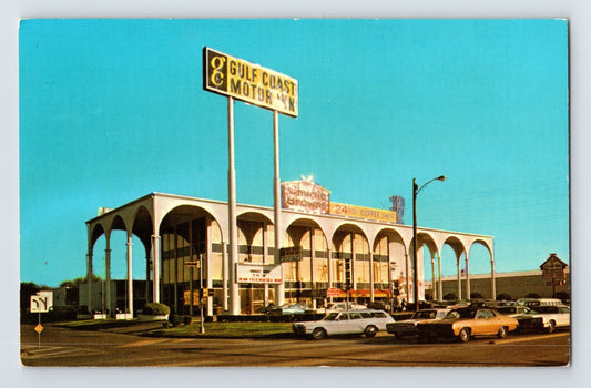 Color chrome postcard showing the Gulf Coast Motor Inn in Houston, Texas, featuring dramatic arched mid-century motel architecture and roadside signage.