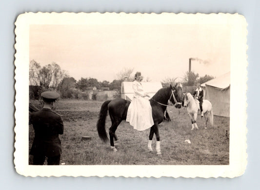 Black and white photograph of Lee Bros Circus cowgirl Erna Rudynoff on horseback 1943 