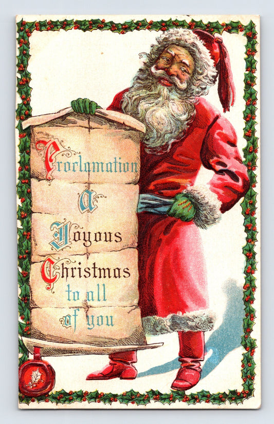 Santa Claus beside a holly-bordered proclamation scroll announcing Christmas greetings in a brightly colored early twentieth-century holiday postcard design.