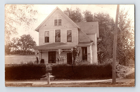 Auburn California residence of dentist J N Ward with wood frame house and detached garage, 1911 real photo postcard