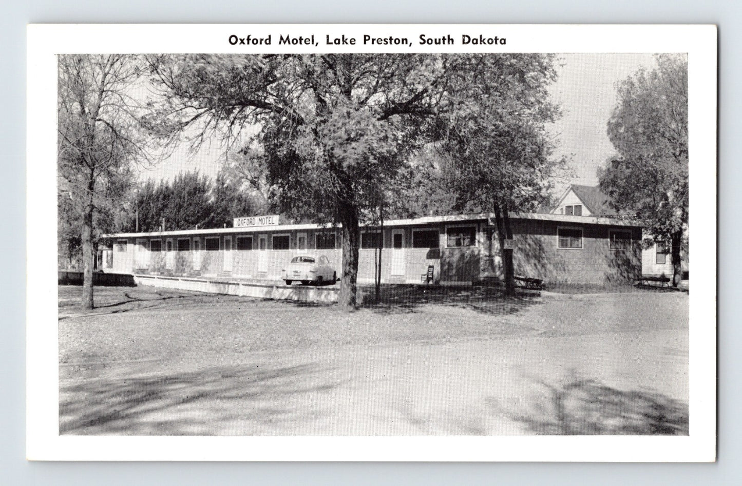 1940s Oxford Motel in Lake Preston South Dakota with single-story motor court and parked car