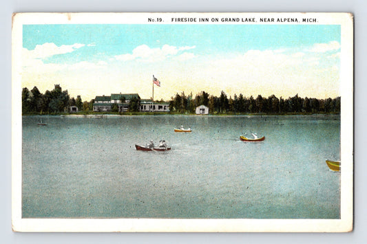 1930s Alpena Michigan Fireside Inn on Grand Lake postcard showing lakeside resort buildings with boats on calm water