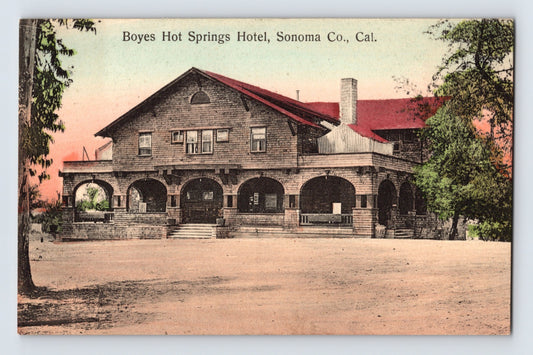 Boyes Hot Springs California hotel postcard showing large shingled resort building with arched porch, red rooflines, and broad front entrance in Sonoma County.