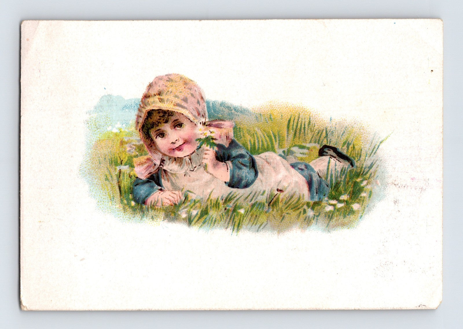 Boston Dental Association Victorian trade card featuring a child lying in grass with dental advertising and artificial teeth pricing on the reverse.