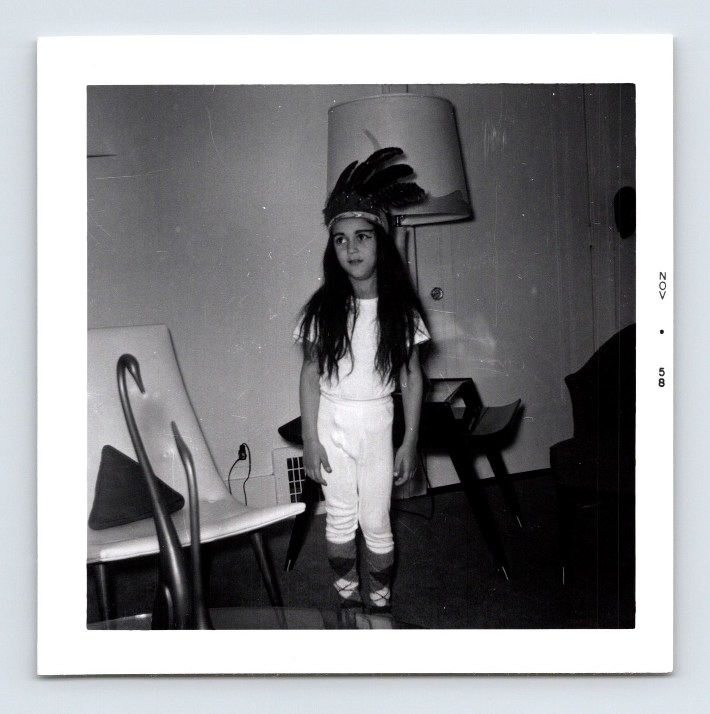 Halloween child feather headdress costume indoor snapshot 1950s vintage photo 3.5 x 3.5