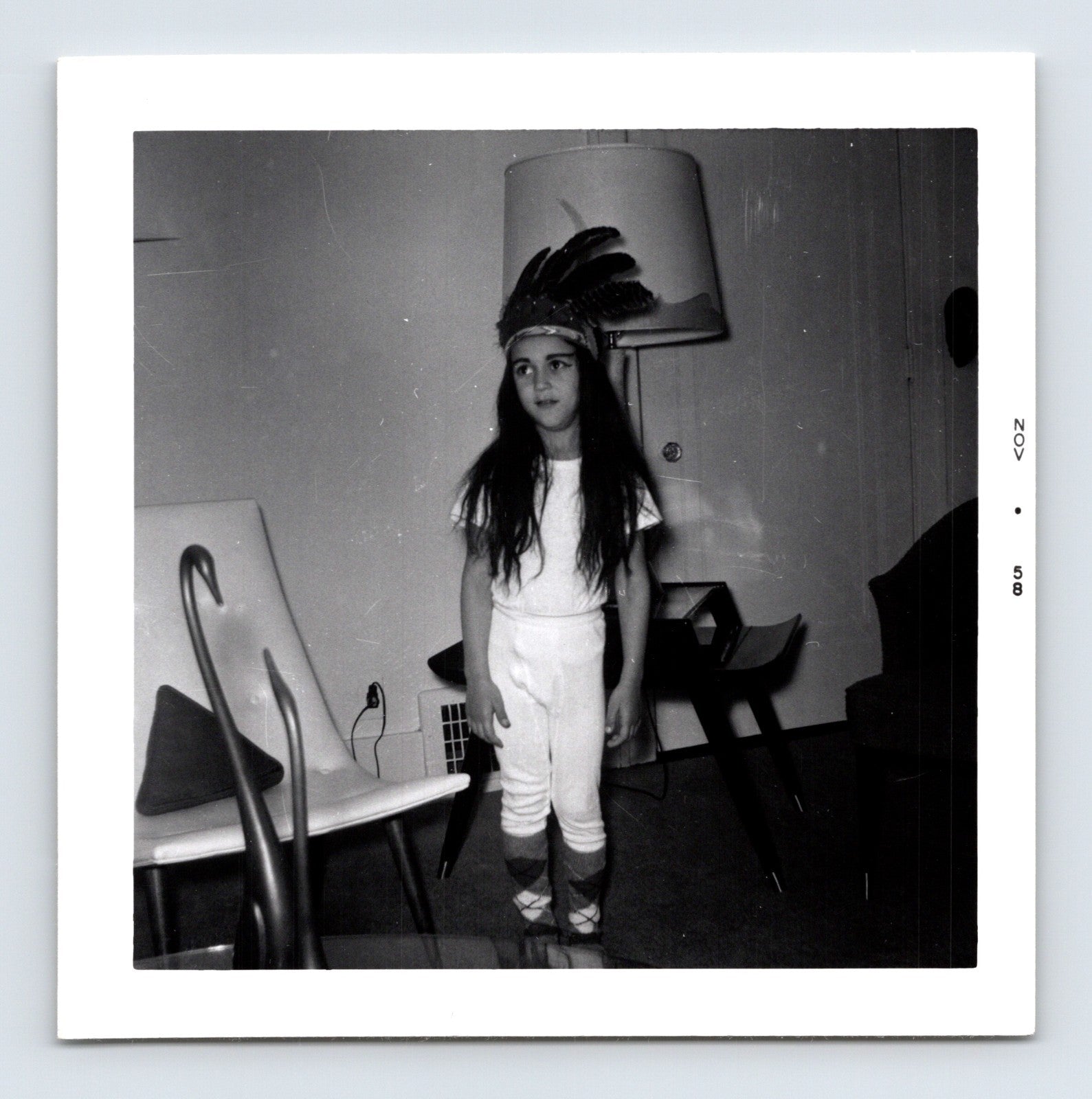 Halloween child feather headdress costume indoor snapshot 1950s vintage photo 3.5 x 3.5