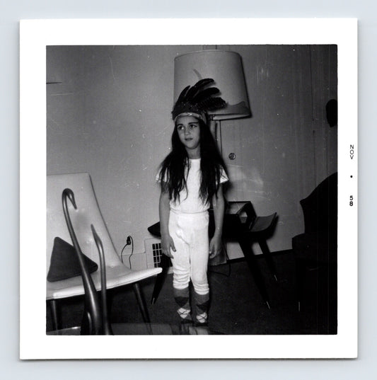 Halloween child feather headdress costume indoor snapshot 1950s vintage photo 3.5 x 3.5