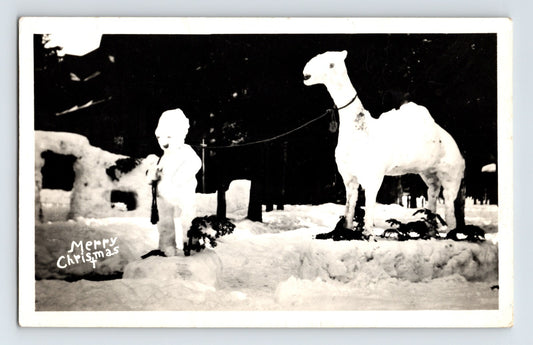 Brockway California snow display with child and white camel Merry Christmas 1947 real photo postcard