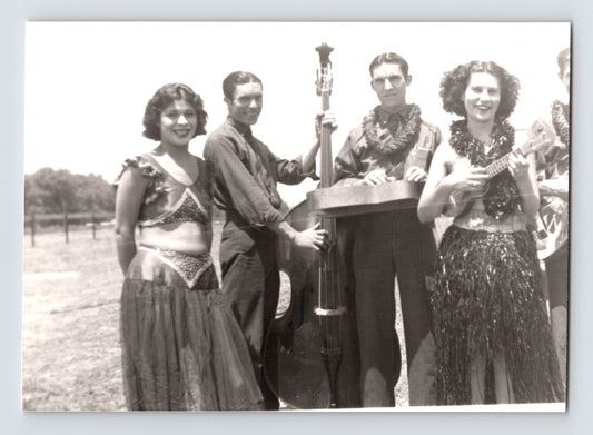 Barnes Sells Floto Circus 1940s performers with string bass and ukulele on circus grounds photograph