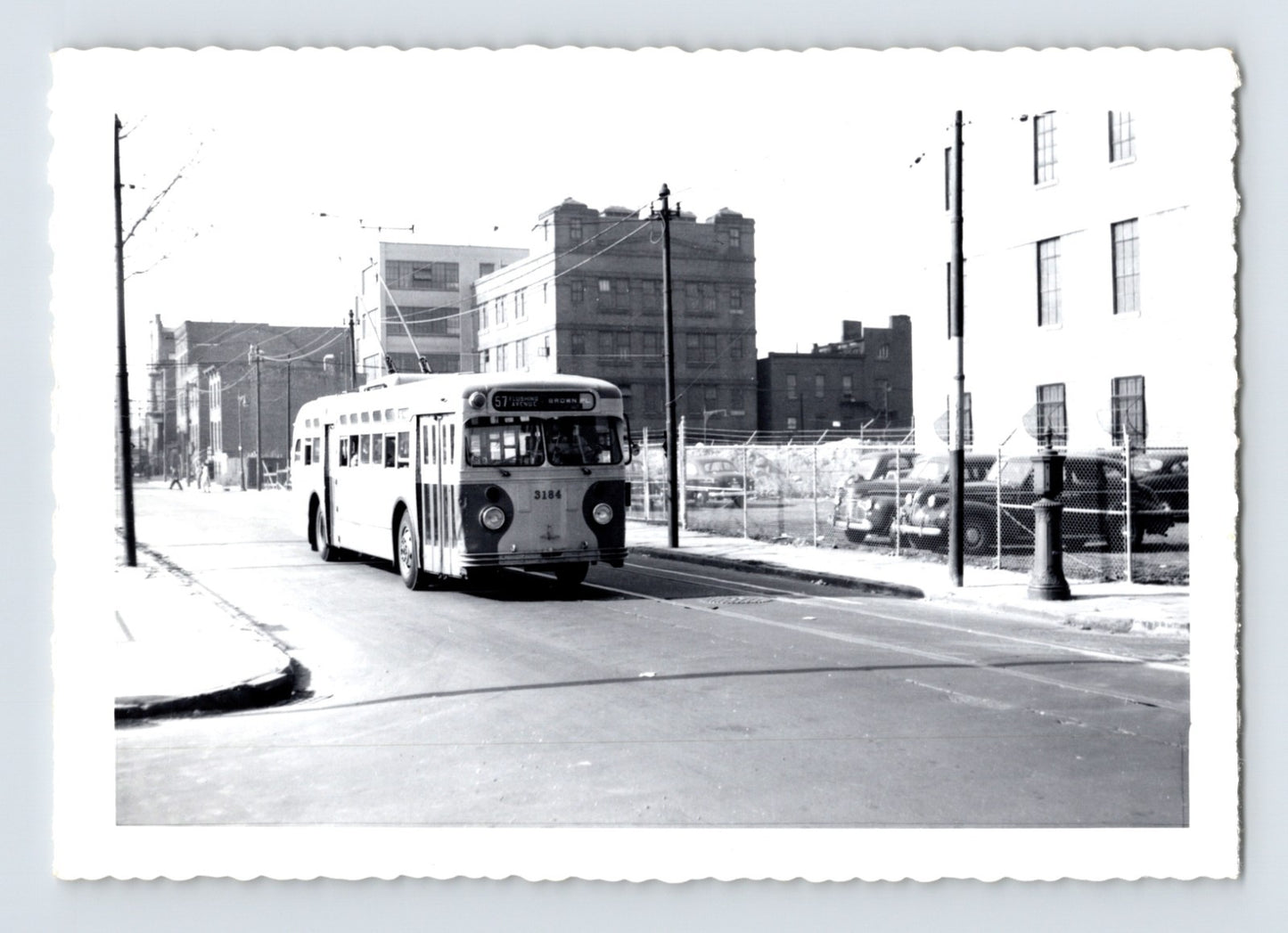 Flushing Avenue Line trolley bus no 3184 on Hudson Street Brooklyn with destination sign Flushing Avenue Brown Place, urban industrial streetscape, 1960s black and white photo