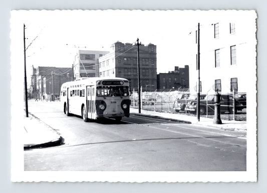 Flushing Avenue Line trolley bus no 3184 on Hudson Street Brooklyn with destination sign Flushing Avenue Brown Place, urban industrial streetscape, 1960s black and white photo