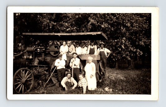 farm family group posing with early tractor agricultural machine rural scene 1940s photo