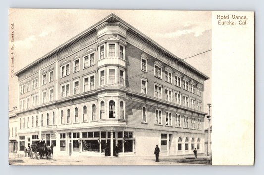 Sepia view of Hotel Vance corner building with arched storefront windows in Eureka California early 1900s postcard