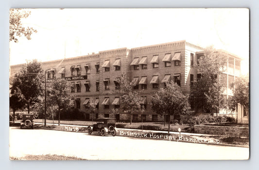 Bismarck North Dakota hospital building automobiles street view 1937 RPPC postcard posted