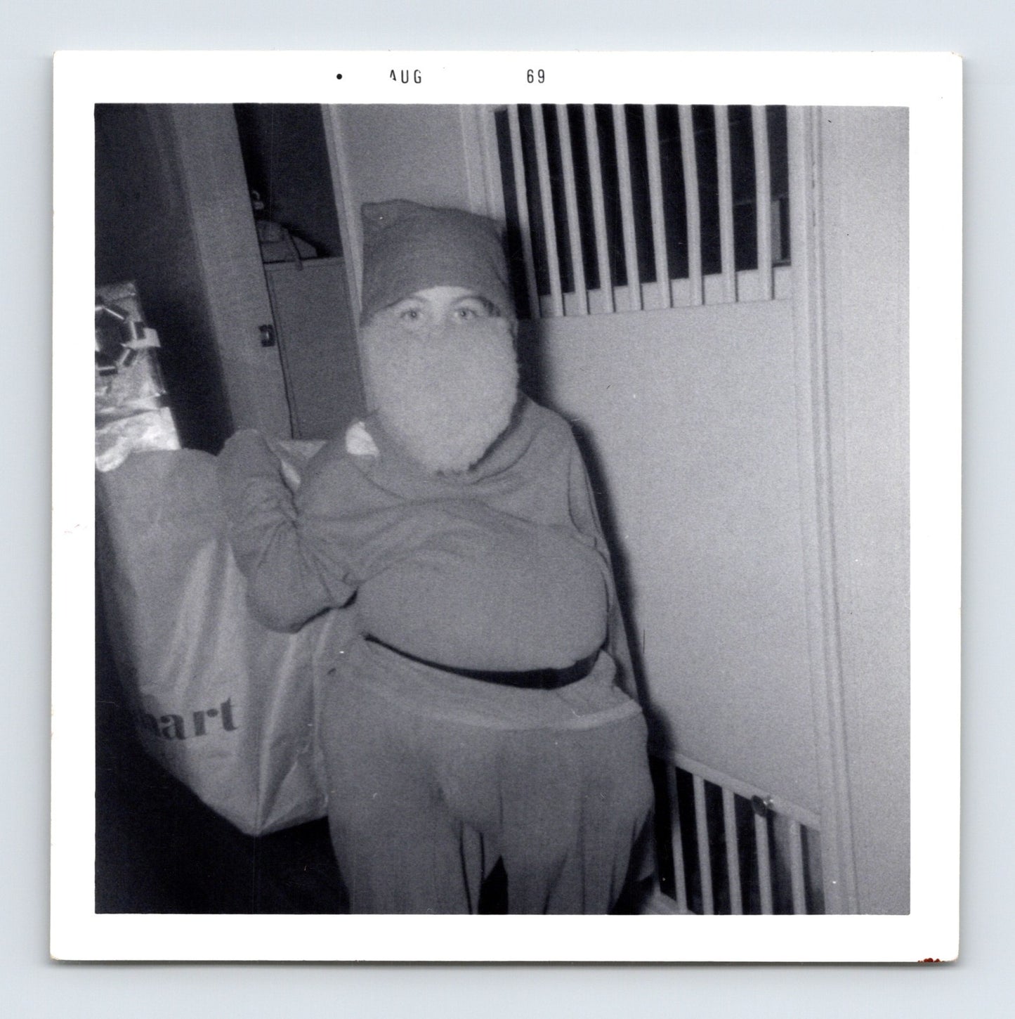 1969 Halloween child Santa Claus costume beard trick or treat bag indoor snapshot square photo