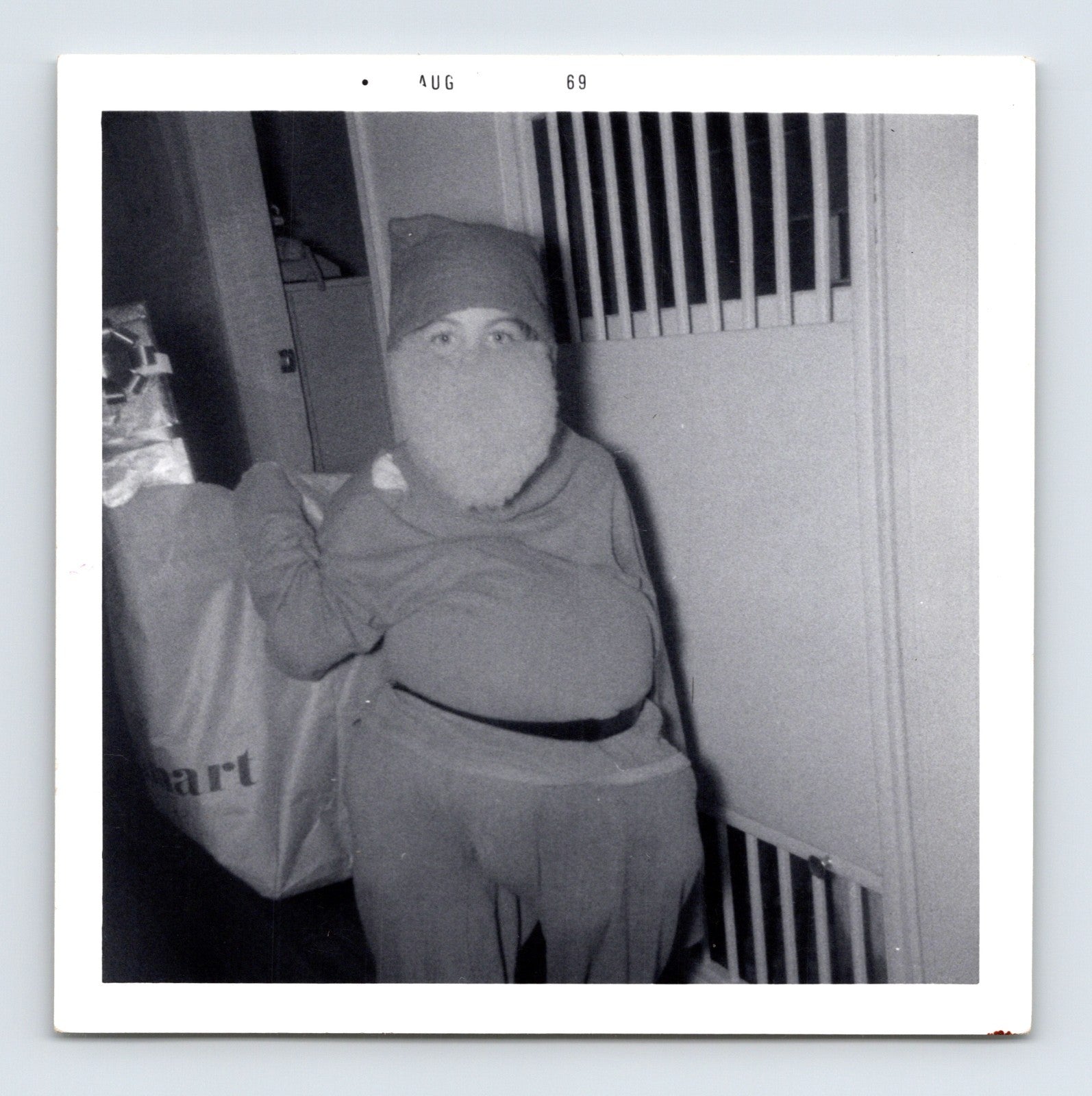1969 Halloween child Santa Claus costume beard trick or treat bag indoor snapshot square photo