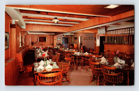 1960s postcard of Allenberry Lodge Carriage Room in Boiling Springs Pennsylvania showing wood-paneled dining room with set tables chairs and rustic interior beams