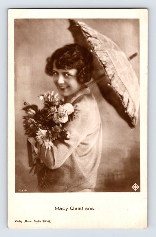 Mady Christians German film actress portrait holding flowers under parasol Ross Verlag real photo postcard 1930s
