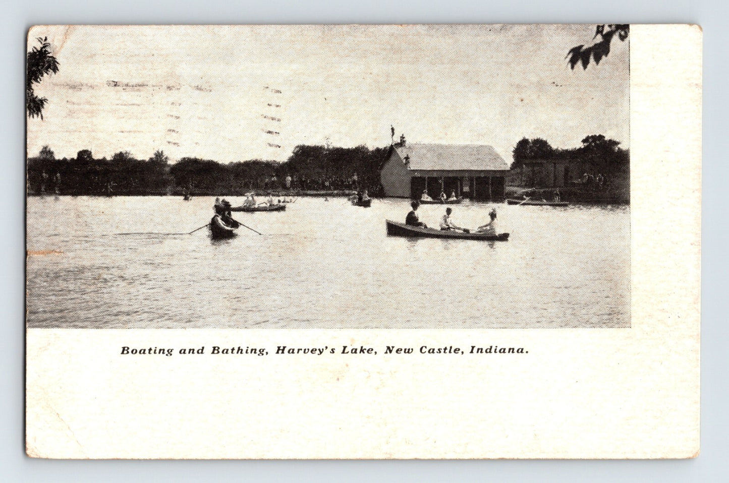 Early 1907 postcard showing boating and bathing at Harveys Lake in New Castle, Indiana with canoeists and lakeside pavilion