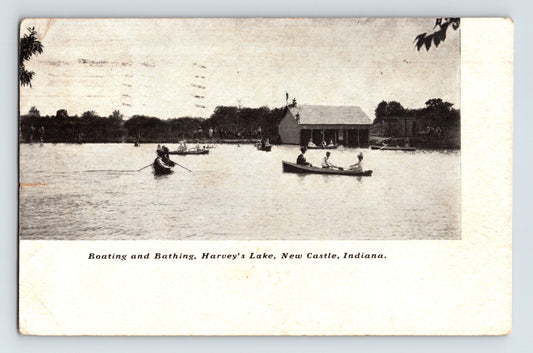 Early 1907 postcard showing boating and bathing at Harveys Lake in New Castle, Indiana with canoeists and lakeside pavilion